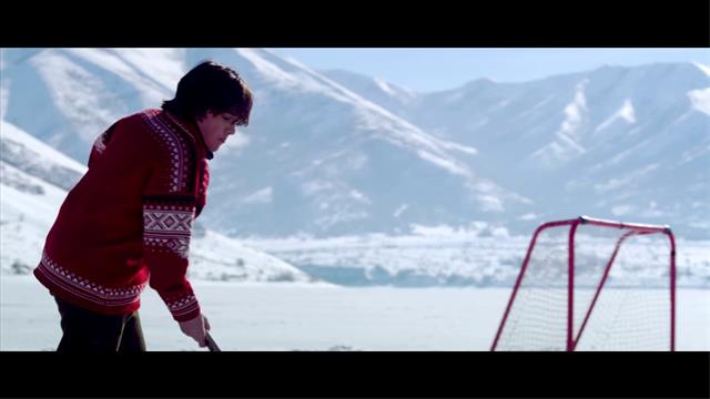 Close Up Of Boy In Red Playing Ice Hockey