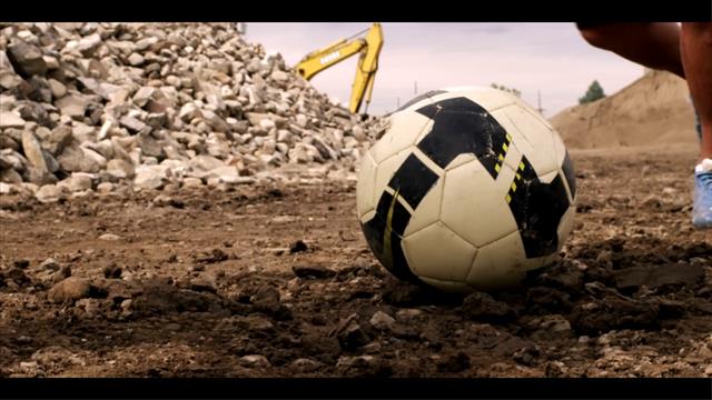 Close Up Of People Playing Soccer Ball