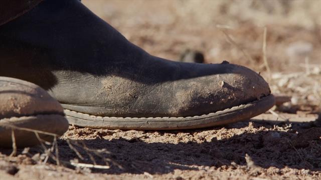 Bullets Drop Near People’s Legs
