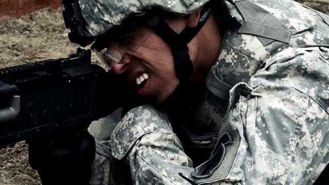 Close Up Of Firing A Weapon Soldier’s Shoulder